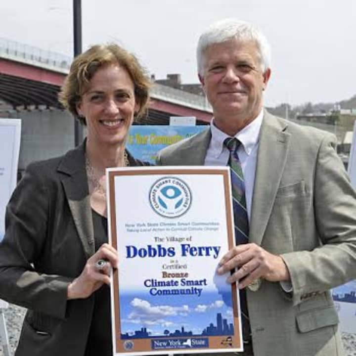 Dobbs Ferry&#x27;s Nina Orville receives a New York state Climate Smart Climate Award from Joe Martens, state commissioner of  environmental conservation.