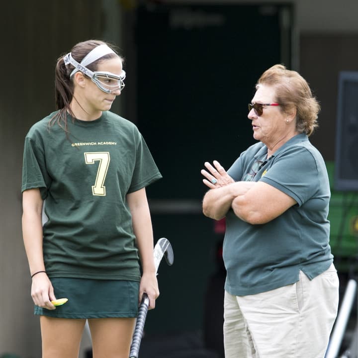 Greenwich Academy sports mainstay Angela Tammero will retire at the end of the school year. Here, she speaks with 2013 field hockey co-captain Annie Leonard.