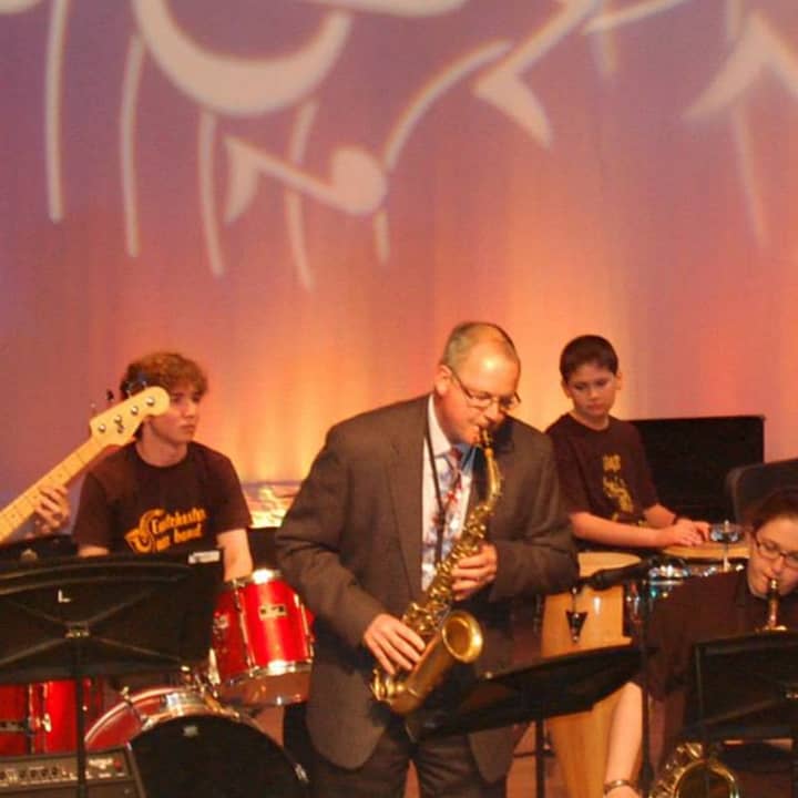 Eastchester Schools Superintendent Walter Moran performs with the Eastchester jazz band. 