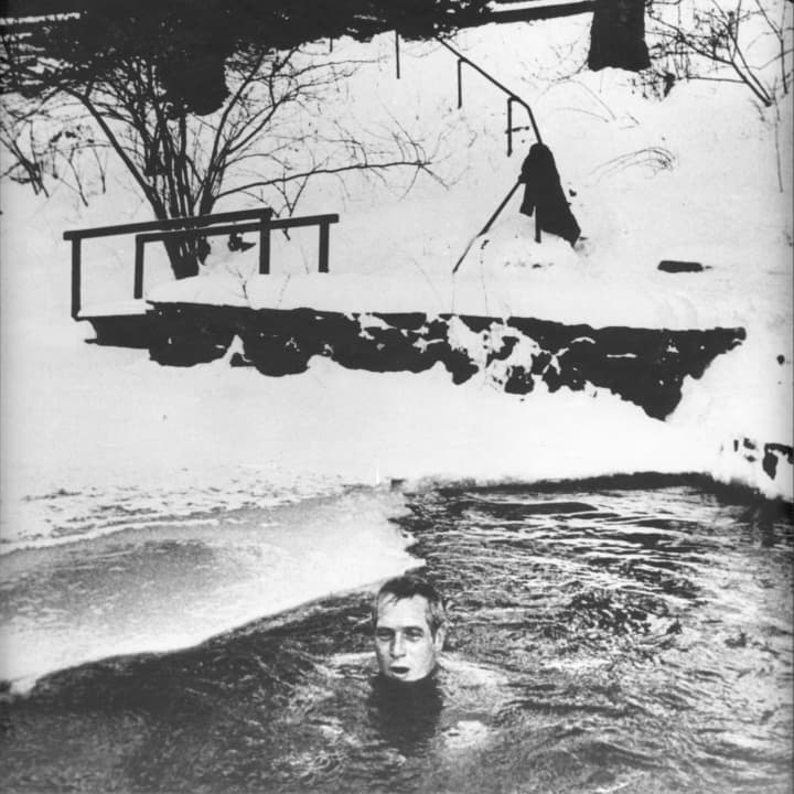 Actor Paul Newman swims in the winter near his Westport home. 