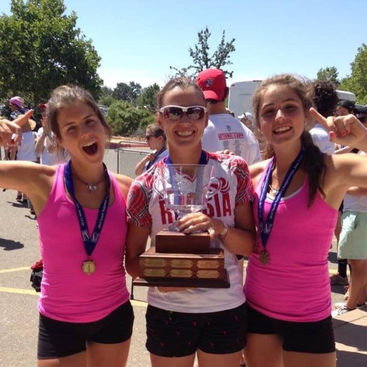 New Canaan&#x27;s Mary and Claire Campbell, with coach Ana Cherednikova, celebrate after winning a gold medal at the USRowing Youth National championships Sunday in California.