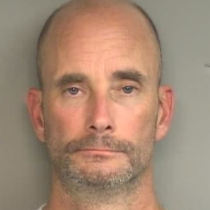 John William King, 45, of Enfield was arrested Sunday on charges of impersonating a police officer in an encounter with a woman early Sunday in Stamford.