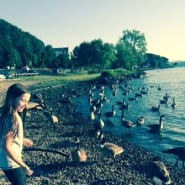 A young girl from Brooklyn traveled to Peekskill to enjoy the Riverfront Green Park on a summer night.