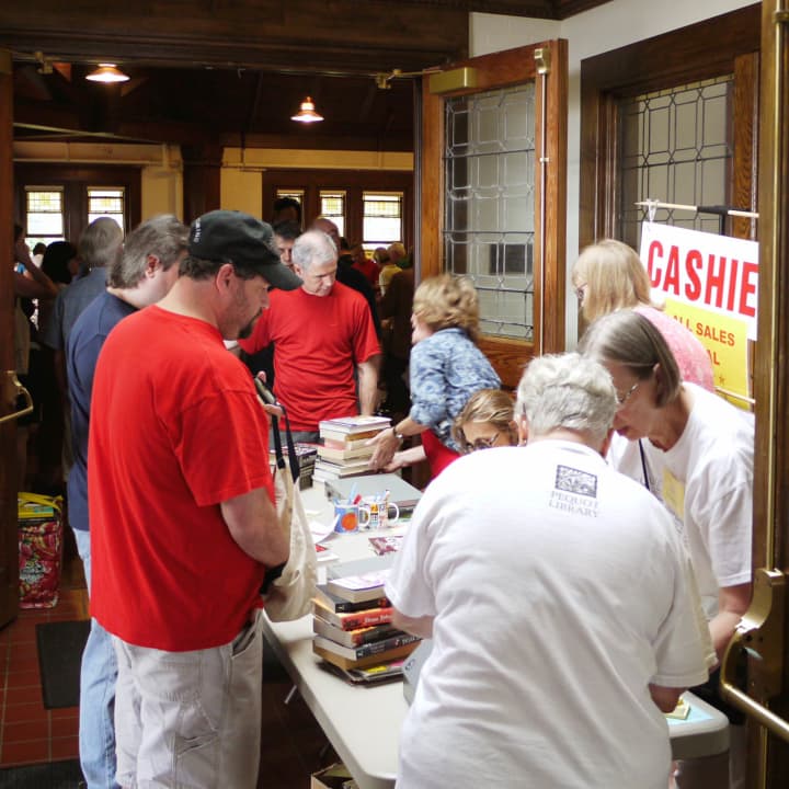Hundreds turn out to the Pequot Library Annual Summer Book Sale in Fairfield from all around the state and the region to peruse one of the largest library book sales in the state.