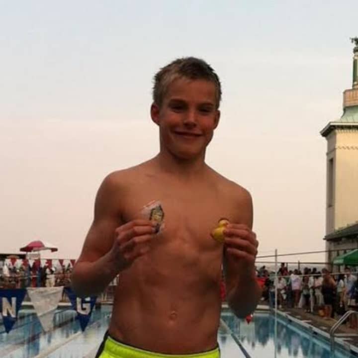 Ryan Maierle displays his first-place medals at the Westchester Swimming Championships on Thursday, July 31.