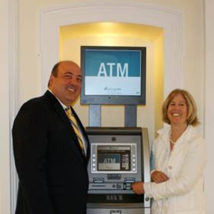 Robert Granata, president and COO of First County Bank, and Alice Knapp, interim president of The Ferguson Library.