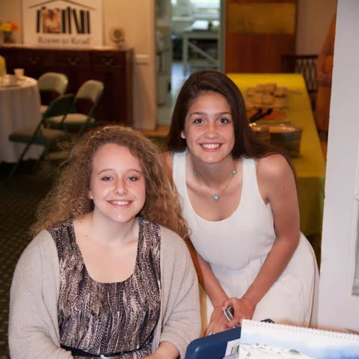 Sasha Kran, left, and Isabella Bricker of the Room to Read Club at Pelham Memorial High School attended a student luncheon to raise funds for Sri Lanka school library.