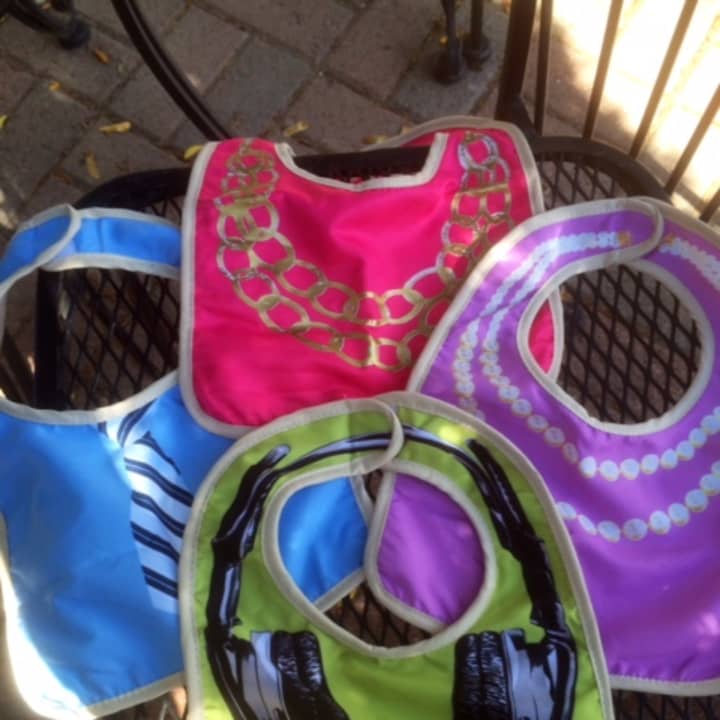 Sunshine &amp; Clover in Croton-on-Hudson offers bibs with headphones and necklaces on them.