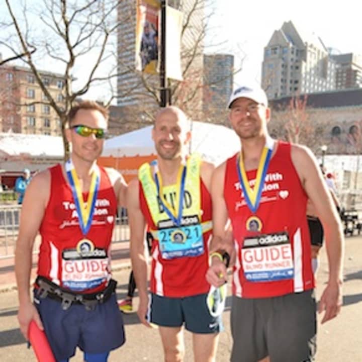 Thomas Panek, center, will run in the NYC marathon.