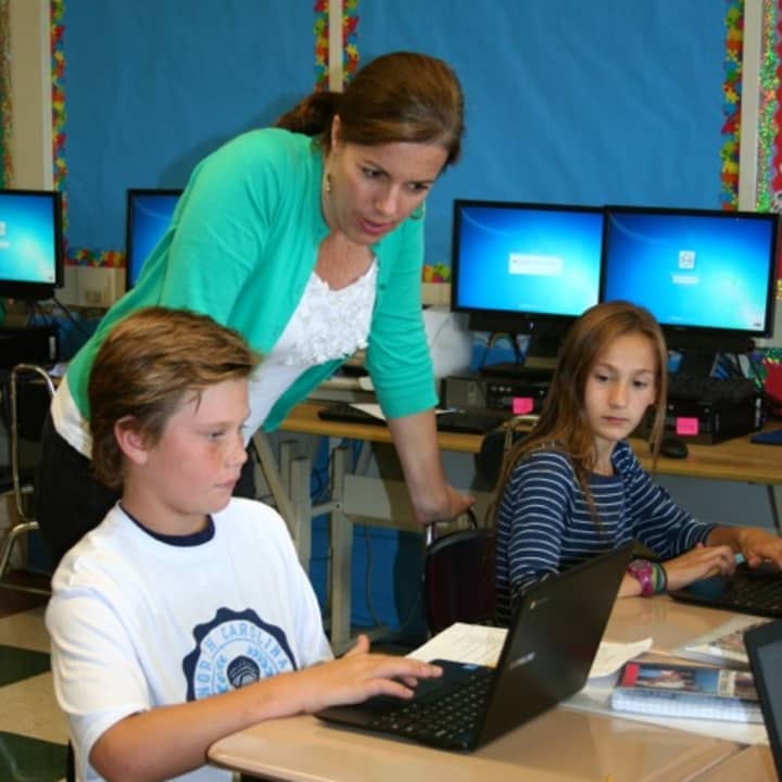 Bronxville fifth-grade teacher Stephanie Kennedy and her students Preston Maze and Caroline Ircha working with Chromebooks and Google Apps for Education made possible by Bronxville School Foundation grants.
