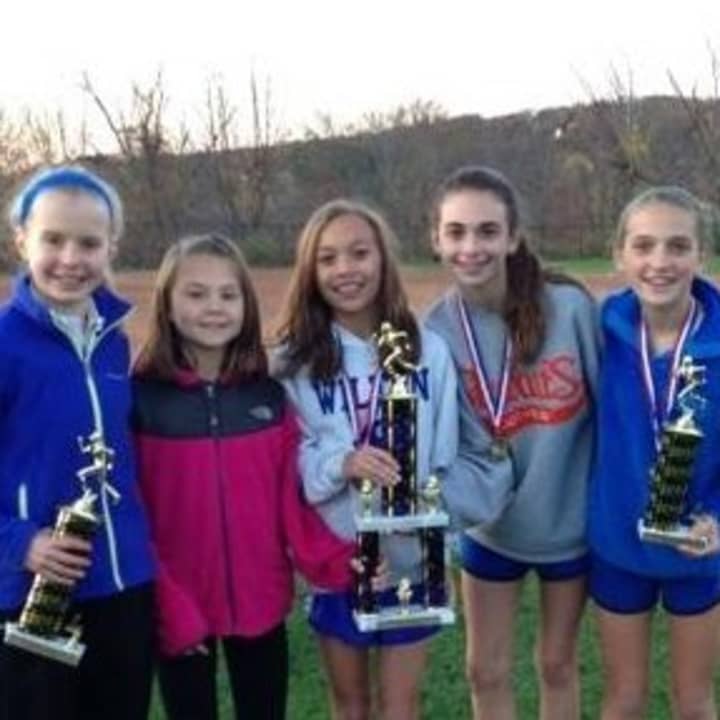 Girls on Wilton Running Club celebrate after winning the conference championship meet on Monday.From left are Angela Saidman, Ashley Nicoletti,
Emily Welch, Lauren Klym, Tess Pissanelli and Lily Kealy.