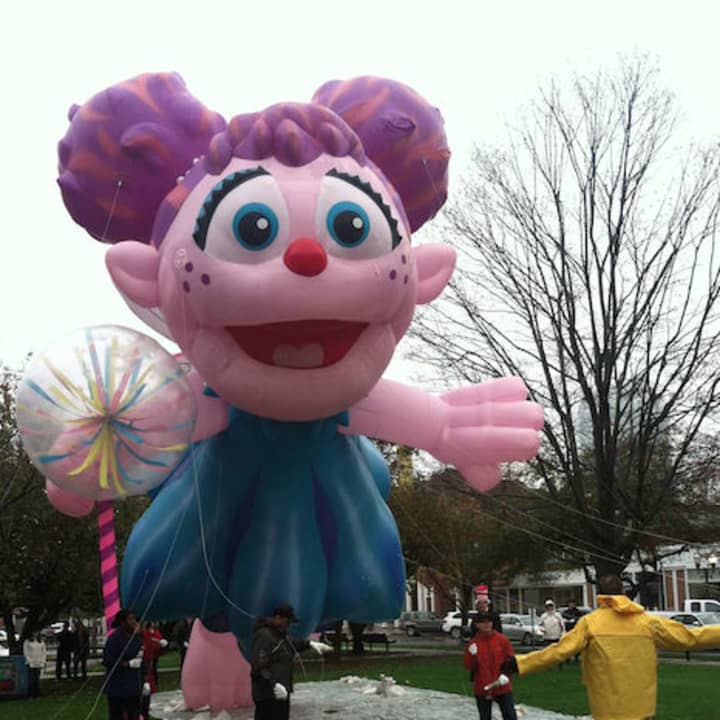 Volunteers let the 35-foot high Abby Cadabby balloon rise during the press conference Thursday announcing the Nov. 23 UBS Parade.