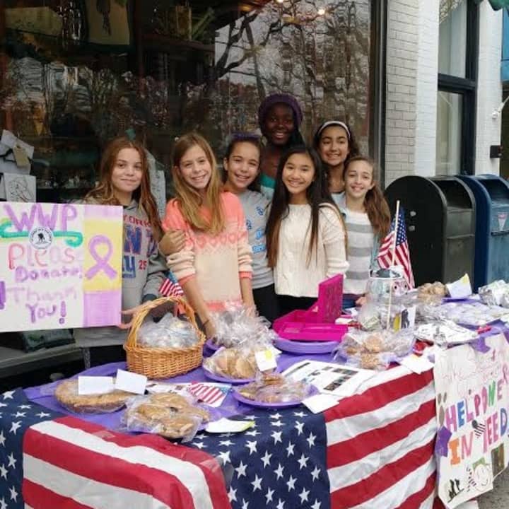 Emma Spada and her schoolmates Lexi Wierdsma, Maelani Groff, Lily Drude, Abby Sirota, Kayla Johnson and Victoria Cartularo at the bake sale to raise money for the Wounded Warrior Project. 