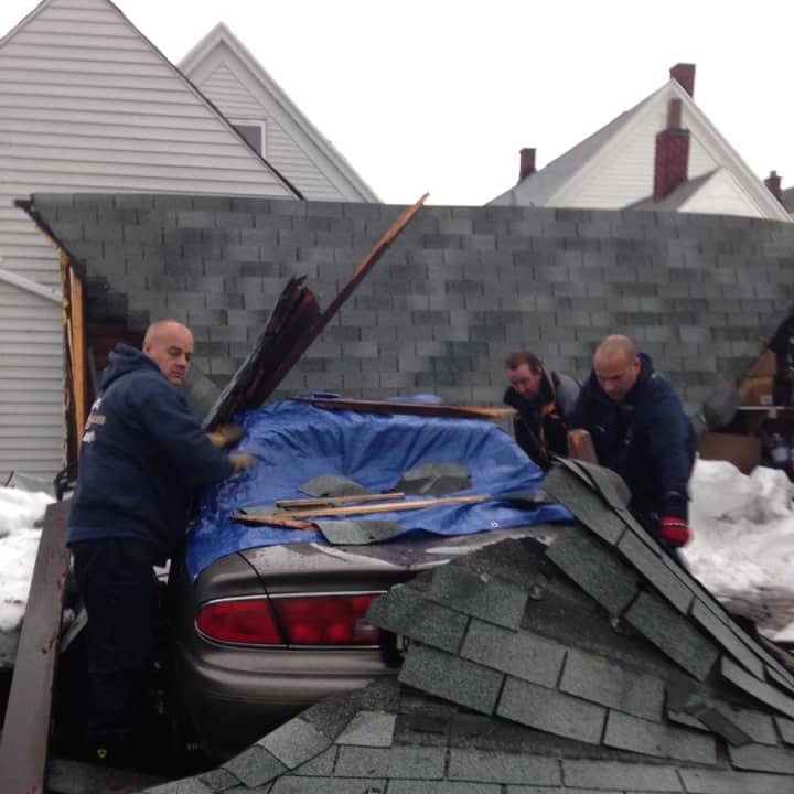 YFD helped a 75 year old woman,who lives alone, with her car covered by her garage collapse.
FF Brian Turenchalk, FF Brendan Healy, FF Frank Palmer (YFD, left to right) removed the garage roof from the car and covered it.