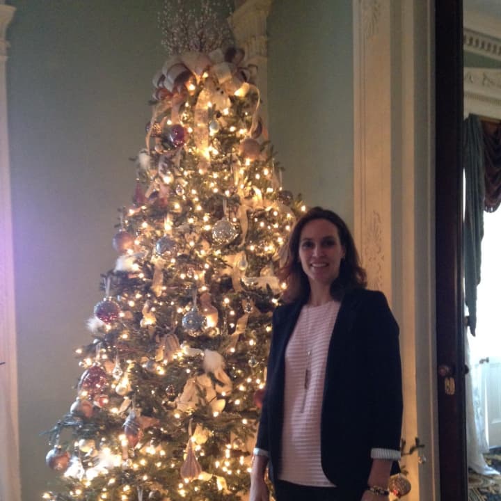 Pelham resident Alice Pirsu with the tree she decorated for the Bartow-Pell Mansion Museum.