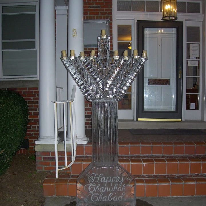 Ice artist TJ Neary from Touch of Ice will carve a glittering ice menorah at Ridge Hill&#x27;s menorah lighting. 