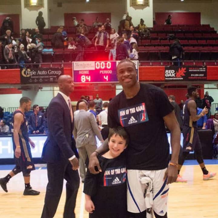 Westchester Knicks Fan of the Game, and Birthday Boy Daniel Karetsky of Rye Brook, with Player of the Game Thanasis Antetokounmpo.