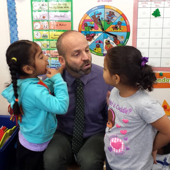 Leake &amp; Watts Executive Director Alan Mucatel talks with children at the Leake &amp; Watts Ames Early Childhood Learning Center in Yonkers. 