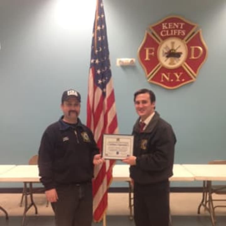 From left: KVFD Chief Justin Byrne and President Kevin Byrne display the certificate of appreciation from the New York State Department of Environmental Conservation.