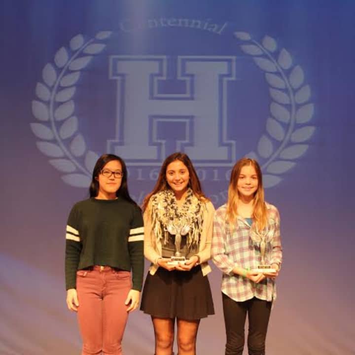 From left, Giana Yang, honorable mention; upper school winner Julia Chatzky, middle school winner Emma Spada.
