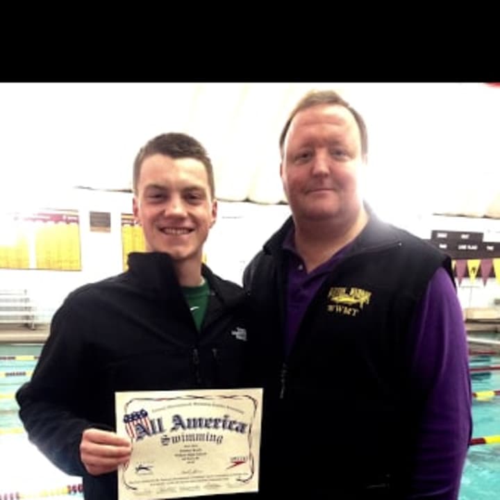 Tommy Kealy and WHS swim coach Todd Stevens with Kealy&#x27;s interscholastic All-American certificate.