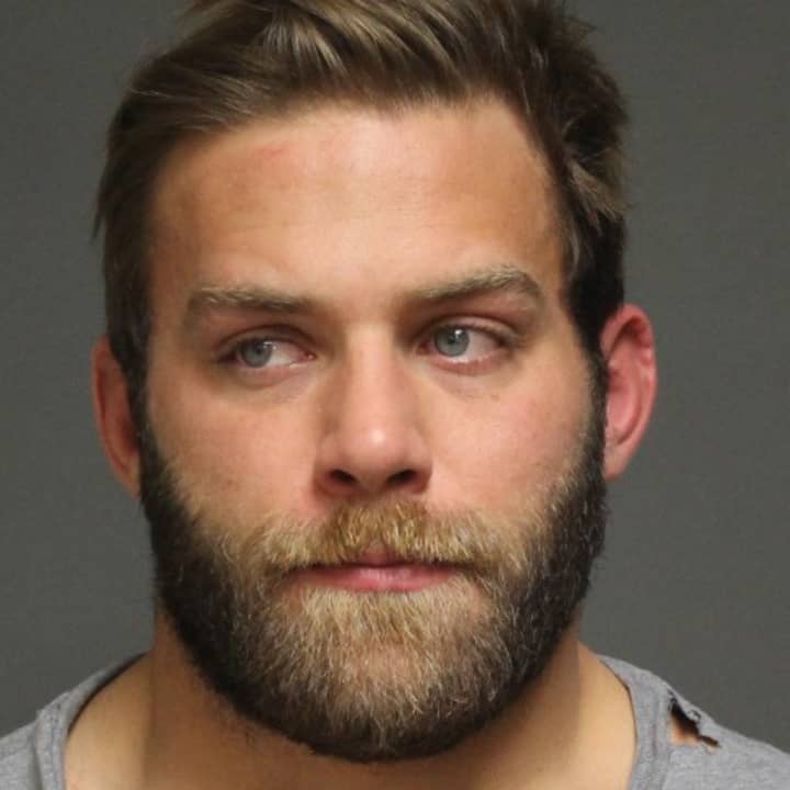 David Bernstein, 28, has been suspended as wrestling coach of Staples High after his arrest in Fairfield. 