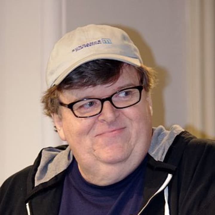 In a speech Friday, filmmaker Michael Moore lambasted Sarah Lawrence College officials response to a building workers union forming on campus, according to lohud.com.