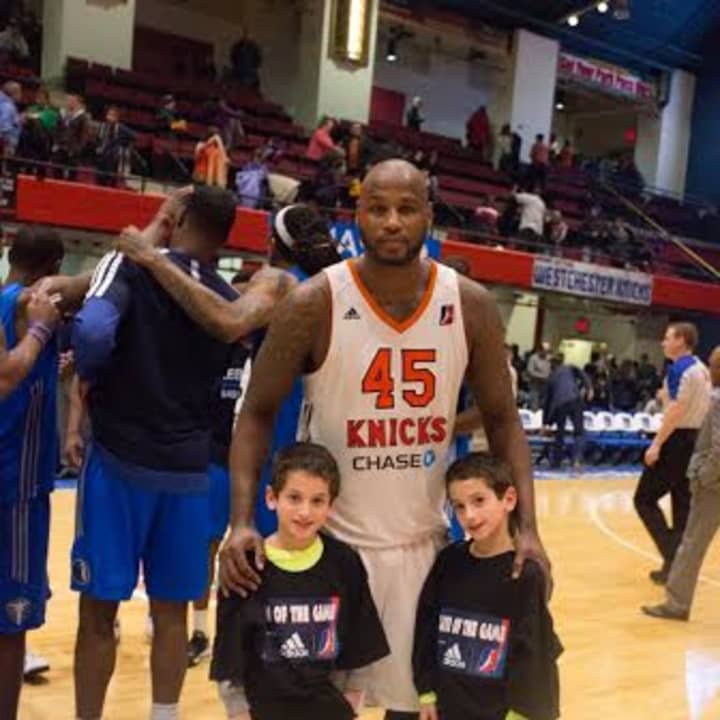 Westchester Knicks&#x27; ADIDAS Player of the Game Darnell Jackson with the ADIDAS Fans of the Game Eric and Oliver Engel from Mount Kisco.