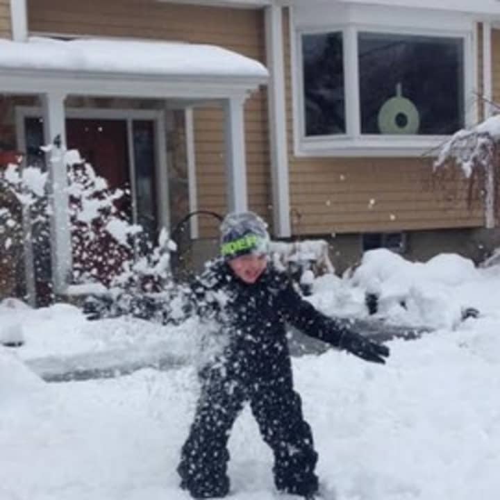 Jakob Sweeters, a 5-year-old from Norwalk, jumps right into the snow after a &#x27;blizzard&#x27; hit the area late Monday and into Tuesday. 