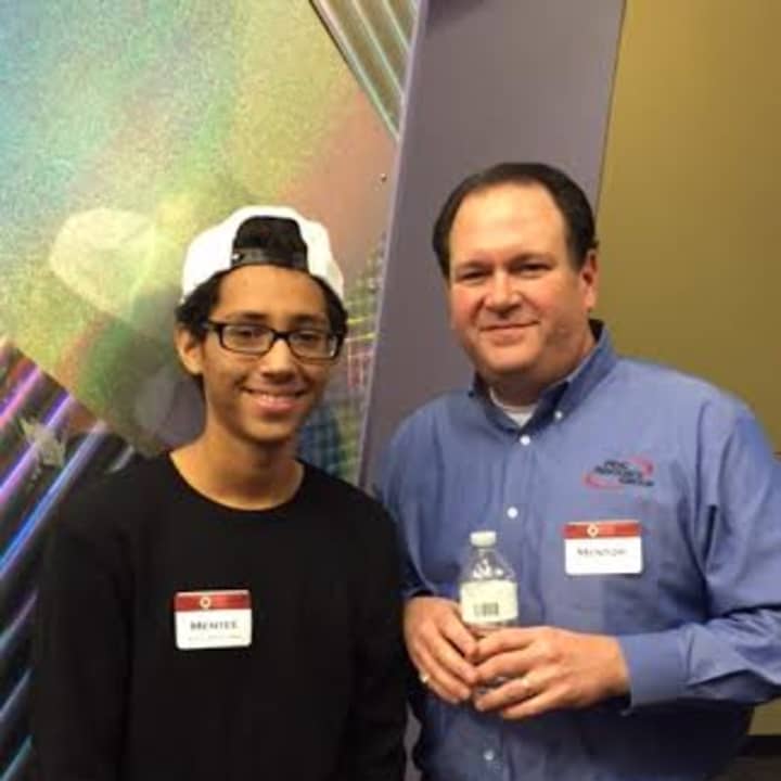 Mentor Neal Konstantin, right, celebrates with Mentee  Michael Hidalg of Nathan Hale Middle School as The Human Services Council of Norwalk honored mentors and mentees in the Norwalk Mentor Program last week.