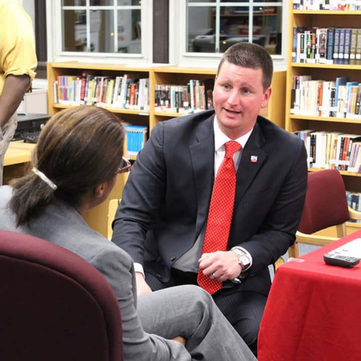 Superintendent Joseph Ricca talks to a parent during his Coffee and Conversation meeting at the high school.