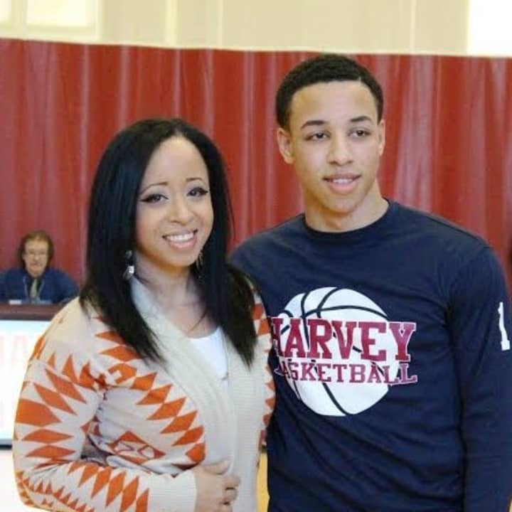 Ricky Hicks of Yonkers stands with with his mother, Cinthya Pages, after scoring his 1,000th career point for Harvey School.