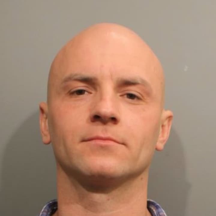 Jan Adamovic of Stamford is facing fourth-degree sexual assault and practicing a massage without a license after he allegedly fondled and groped a Wilton woman during a &quot;sound healing&quot; session in mid-February.
