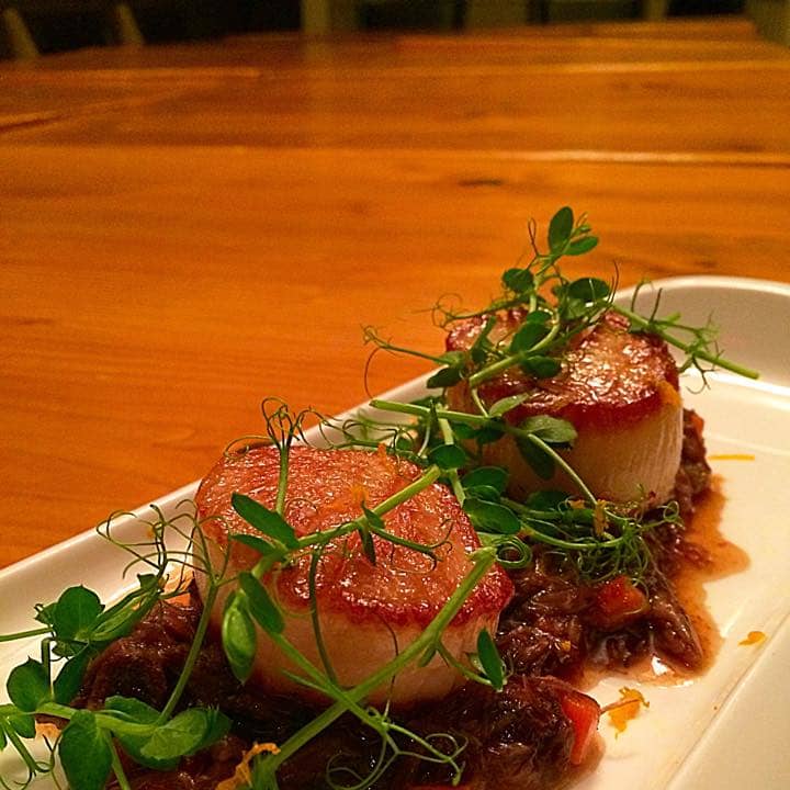Seared diver scallop, oxtail ragout, orange zest at Cooper&#x27;s Mill.