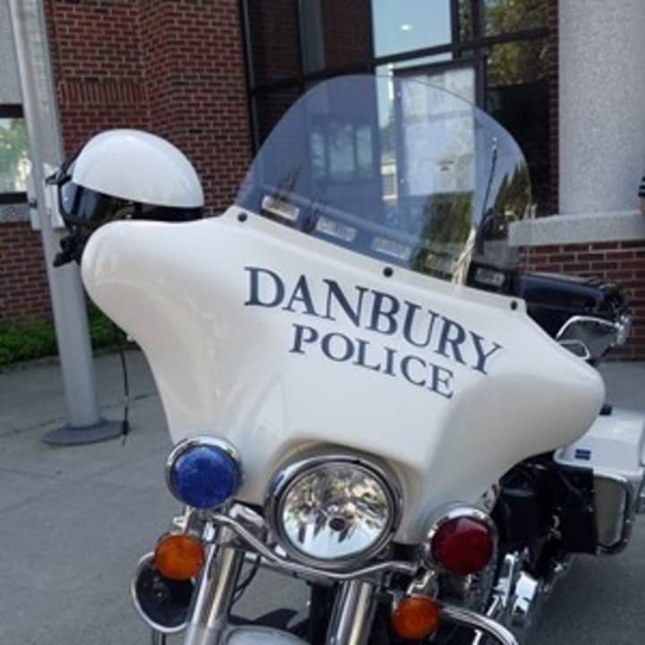 Danbury police arrested two men after a fight in which one hit the other with a pipe.