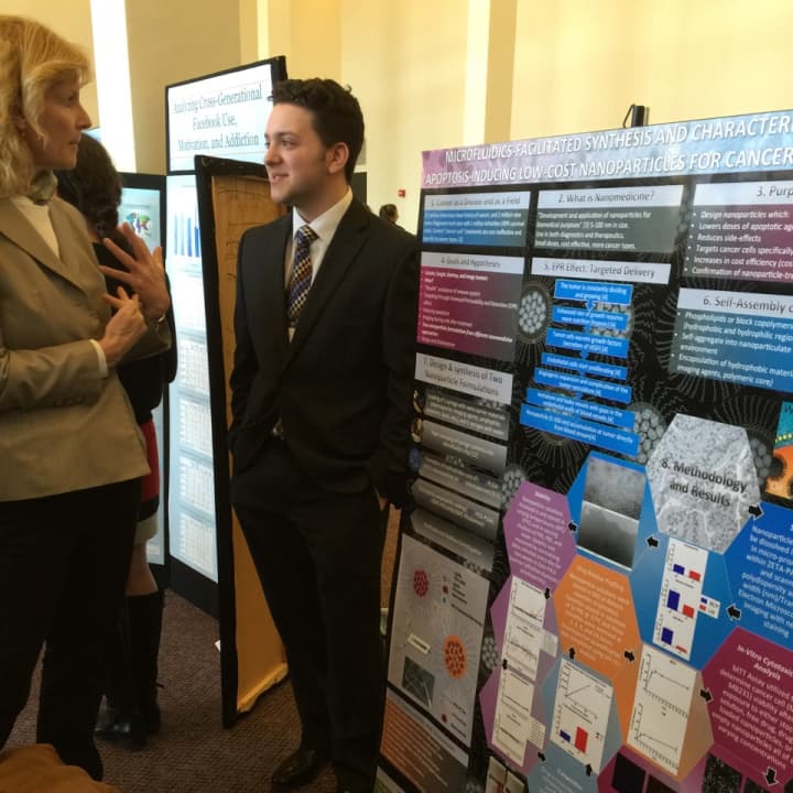 Hendrick Hudson senior Jazz Munitz is shown presenting his poster that placed third at the Upstate New York Junior Science and Humanities Symposium.