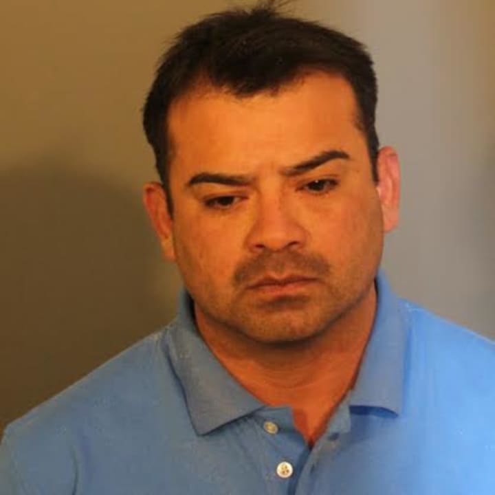Juan A. Garcia-Perales is charged with sexually abusing two young girls over a three-year time period, police said. 