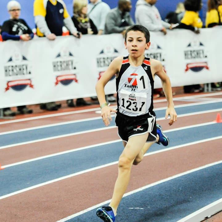 Jonah Gorevic, 11, of Rye races to a new national record of 4:27 in his age group of the 1500-meter run.