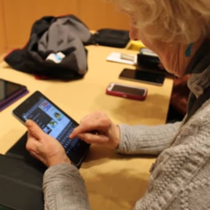 Wilton Library will be upgrading its Wi-Fi system on Tuesday to provide a more robust system as people use more personal devices on a regular basis such as Ann Newton, pictured here. 