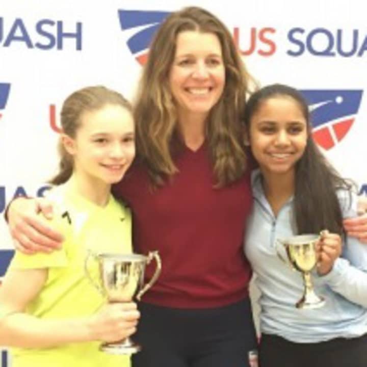 Marina Stefanoni, left and Nina Matel, right celebrate with coach Natalie Grainger. Grainger coaches Stefanoni, of Darien, and Matel, of West Harrison, at Chelsea Piers Connecticut in Stamford.