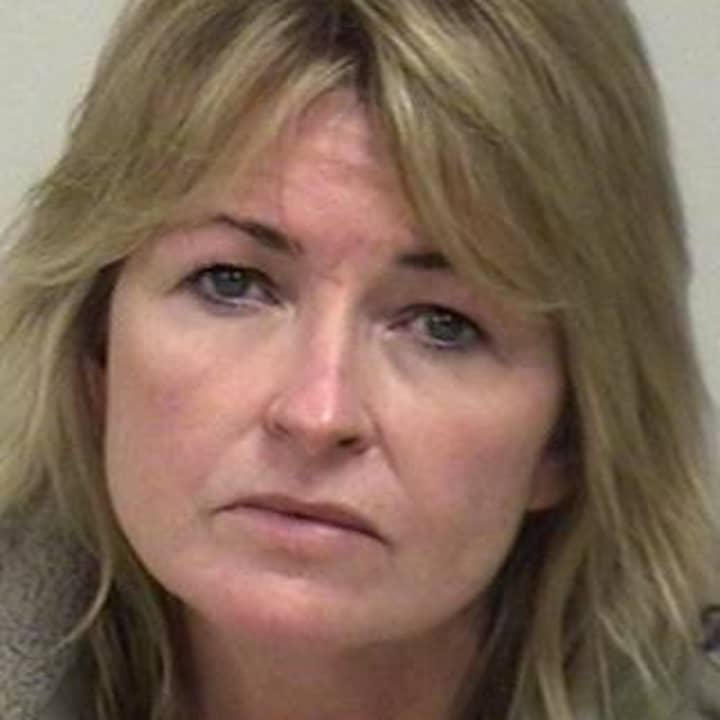 Westport police arrested a Sandy Hook woman after a local attorney complained that she was harassing him.