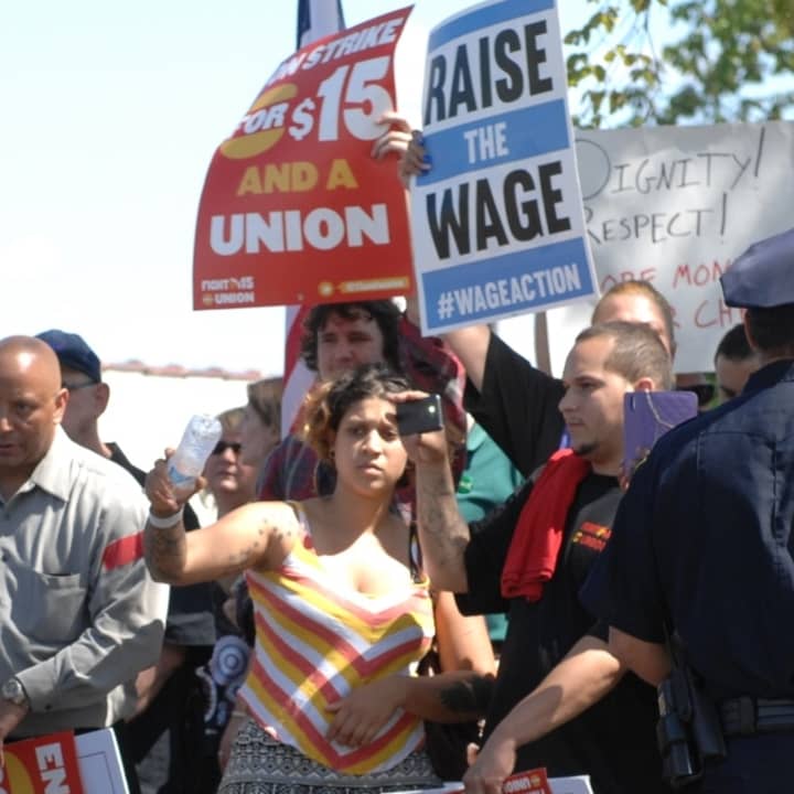 Workers rally for $15 per hour wages last year in Hartford. 