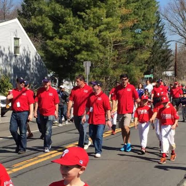Members of the Philly&#x27;s team march in a parade. 