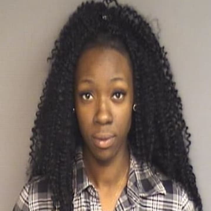 Marya-Erickaysa Lira, 22, of Liberty St., Stamford, turned herself in to police Tuesday morning on a charge of first-degree larceny.