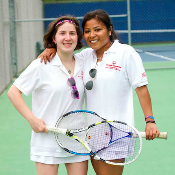 Maya Todrin, left, with her tennis partner Kyra Fitzpatrick. Todrin is participating in the Special Olympic Summer Games this weekend.