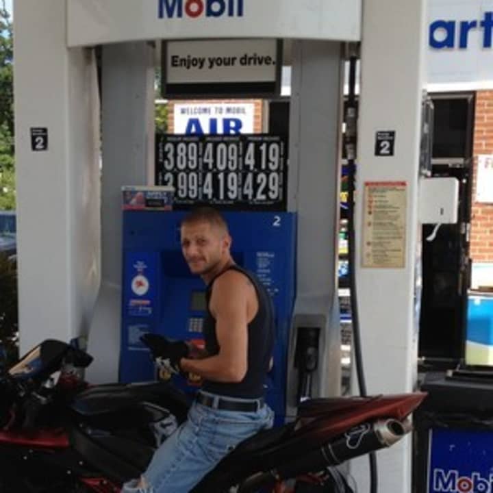 A Tuckahoe resident fills up at a Mobil station. Many stations in Eastchester and Scarsdale have little to no gas.