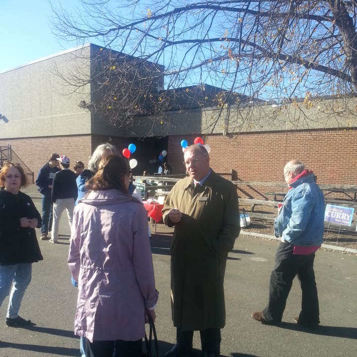 Leon Karvelis, Democratic candidate for State Representative, greets candidates in Weston.
