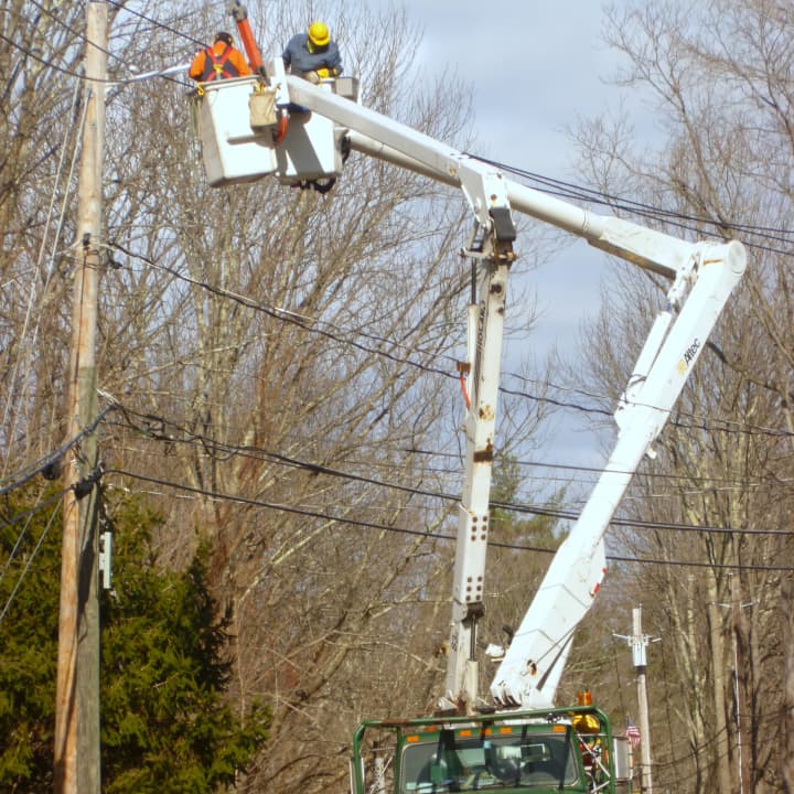 Line crews at work last week in Pound Ridge in the wake of Hurricane Sandy. Power to the town is now nearly completely restored.