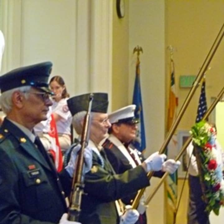 From left, veterans Rob Tirreno, Larry Tirreno and Frank Vino hold the colors during Westport&#x27;s Veterans Day Ceremony.