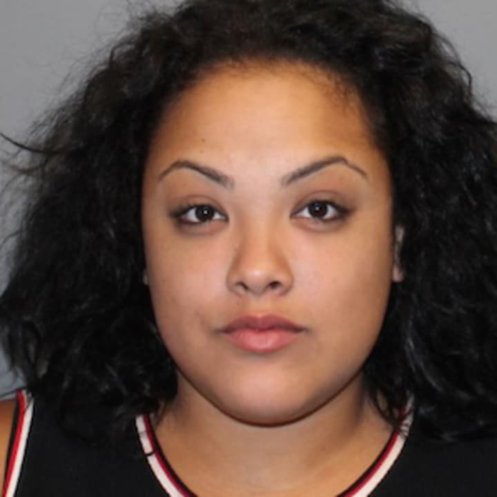 Ashely Aponte, 21, of Norwalk was charged with throwing a bottle at a car and kicking an officer.